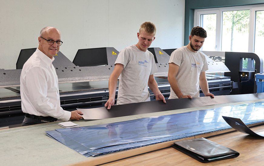 Daniel Huser und zwei Mitarbeitende der Huser Gebäudetechnik AG