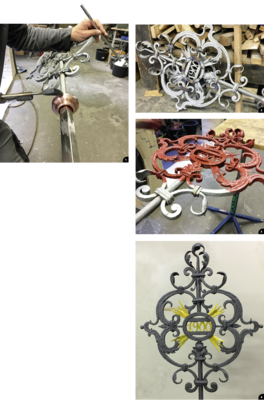 1 Am Übergang zwischen Rund- und Profilrohr wird eine Kugel aus Kupfer platziert﻿
2 Der restaurierte Schmiedeeisen-Dachschmuck zeigt an den Schweißstellen noch Anlauffarben … 
3… er wird anschließend sehr sorgfältig mit mehreren Schutz- und Grundierungsanstrichen konserviert
4 Die endgültige Lackierung erfolgt im Farbton Anthrazit. Die zur Vergoldung vorbereiteten Strahlen sowie die Jahreszahl des Baujahres 1900 wurden in einem hellen Gelbton lackiert 