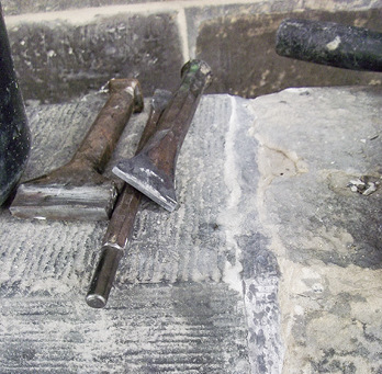 Setzeisen und fertige Fuge
