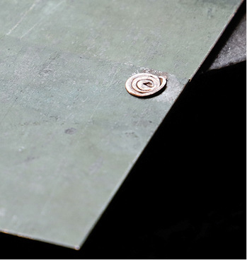 <p>
</p>

<p>
Geschafft: Die Formgebung des gesetzten Rollniets erinnert an ein gedrehtes Schneckenhaus 
</p> - © BAUMETALL

