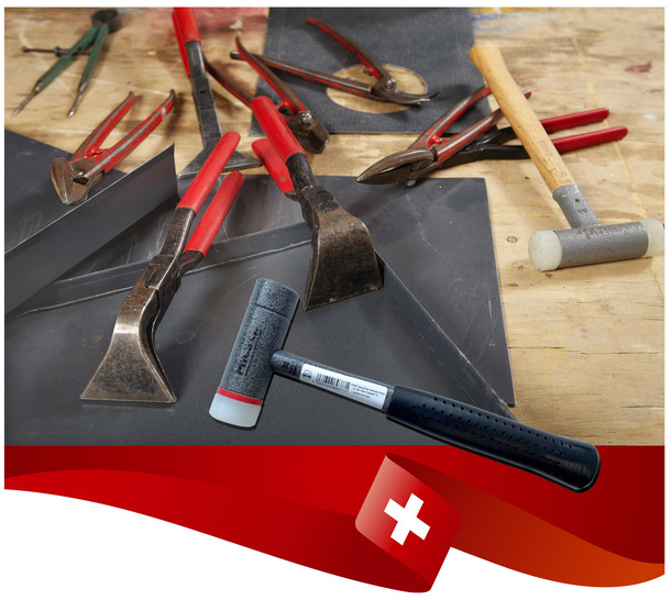 Detail of pliers and trimming tools of roof plumbers on table